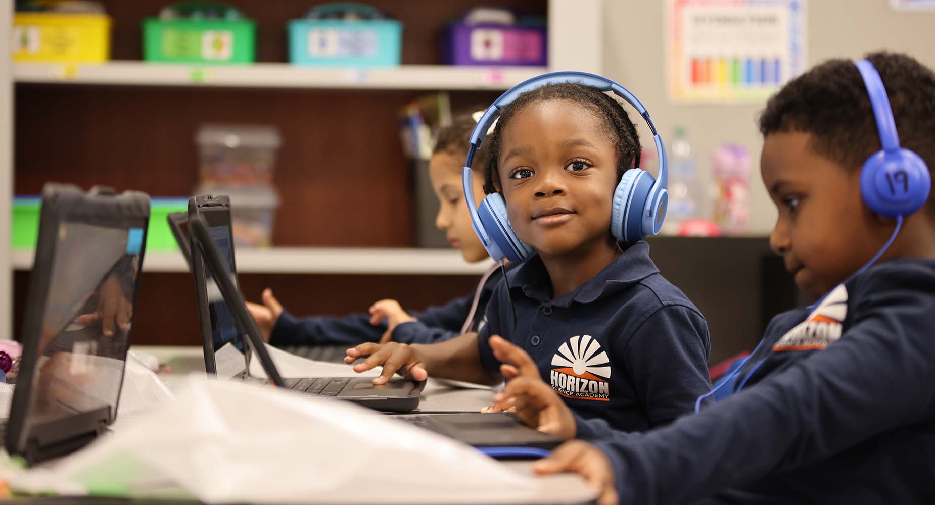 Teacher helping student