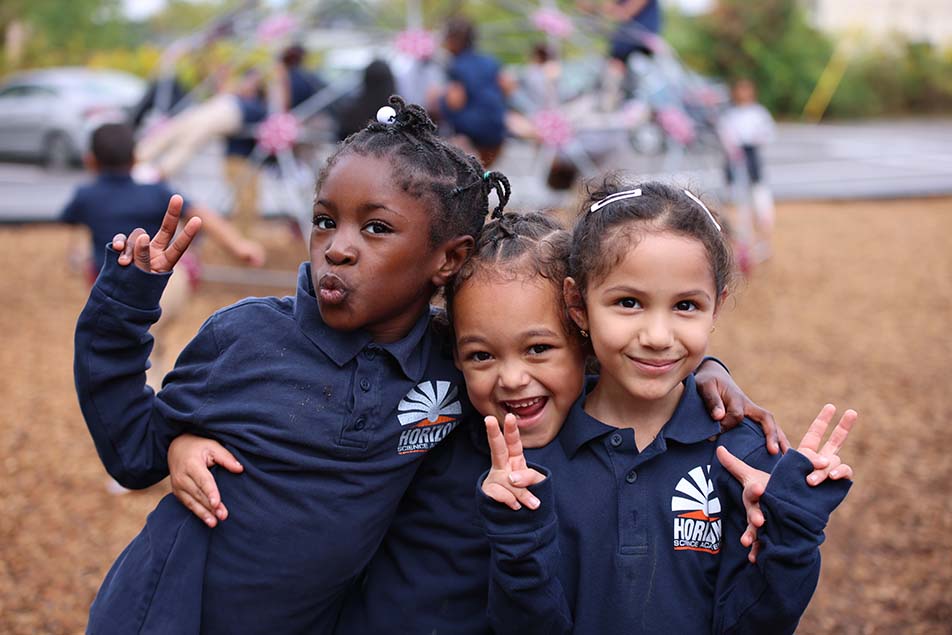 students and teacher working in classroom
