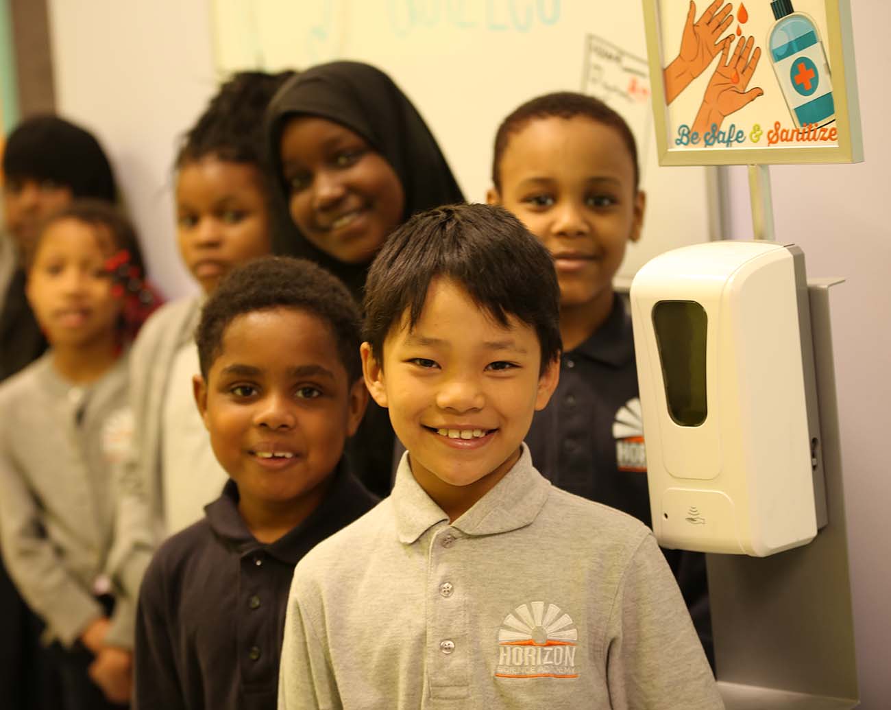Teacher or school staff member warmly interacting with a student outside